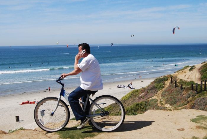 man on cheap beach cruiser
