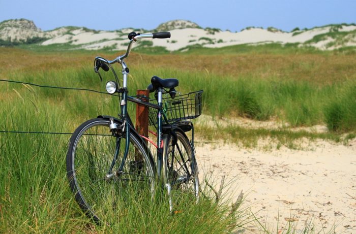 men's beach cruiser bike in sand